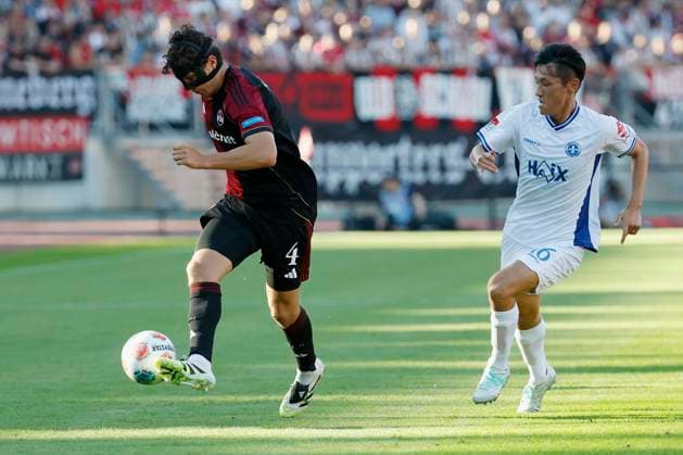 v l Fabio Gruber 1 FC Nuernberg, 4 and Hiroki Akiyama SV Darmstadt, 16 , 08 08 2025, Soccer, 2 Bundesliga, 1 FC Nuernberg SV Darmstadt 98, GER, Nuernberg, Max Morlock Stadion, DFL REGULATIONS PROHIBIT ANY USE OF PHOTOGRAPHS AS IMAGE SEQUENCES AND OR QUASI VIDEO Copyright: HMBxMedia xHeikoxBecker