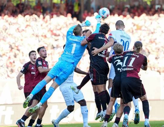 Jan Reichert 1 FC Nuernberg, 1 fists the ball away for a parade GER, 1 FC Nuernberg vs SV Darmstadt 98, Football, 2 Bundesliga, Matchday 2, Season 2025 2026, 08 08 2025 DFL REGULATIONS PROHIBIT ANY USE OF PHOTOGRAPHS AS IMAGE SEQUENCES AND OR QUASI VIDEO GER, 1 FC Nuernberg vs SV Darmstadt 98, Football, 2 Bundesliga, Matchday 2, Season 2025 2026, 08 08 2025 Nuernberg Copyright: xEibner-Pressefoto ScottxColemanx EP_SCN