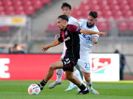 Berkay Yilmaz 1 FC Nuernberg, 21 vs Marco Richter SV Darmstadt 98, 23 GER, 1 FC Nuernberg vs SV Darmstadt 98, Football, 2 Bundesliga, Matchday 2, Season 2025 2026, 08 08 2025 DFL REGULATIONS PROHIBIT ANY USE OF PHOTOGRAPHS AS IMAGE SEQUENCES AND OR QUASI VIDEO GER, 1 FC Nuernberg vs SV Darmstadt 98, Football, 2 Bundesliga, Matchday 2, Season 2025 2026, 08 08 2025 Nuernberg Copyright: xEibner-Pressefoto ScottxColemanx EP_SCN