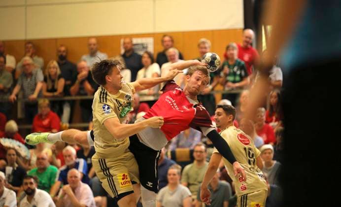 Photo Thomas Arnoldsen Aalborg throws against Thomas Alfred SOLSTAD left , Burgdorf Hannover Handball Men international, pre-season preparation at the Heide Cup in Schneverdingen on Fri 08 08 2025 TSV Hannover Burgdorf Aalborg BK