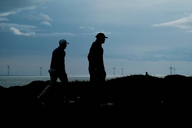 UK: Nexo Championship, Old Course at Trump International Golf Links, Aberdeen, Scotland on 08 August 2025: Pictured: Silhouette of Jeremy Freiburghaus (Switzerland) and Christofer Blomstrand (Sweden) on the 12th green during the second round of the Nexo Championship 2025 at Trump International Golf Links, Aberdeenshire, Scotland Aberdeen Trump International Golf Links Scotland Copyright: xAlexxToddx