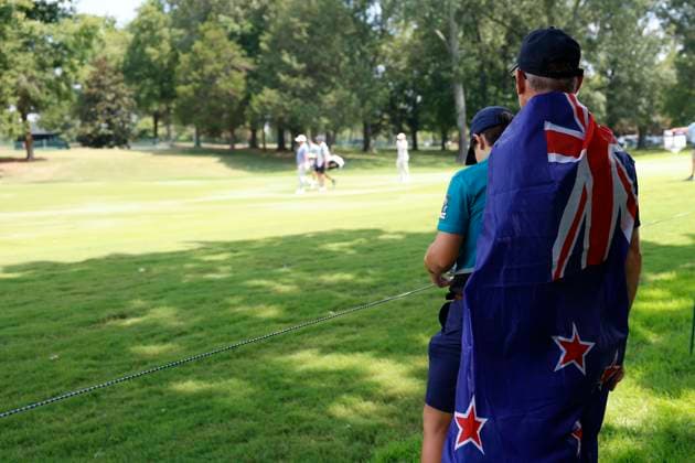 MEMPHIS, TN - AUGUST 08: A fan wearing a New Zealand flag watches as Ryan Fox of New Zealand walks down the No. 3 fairway during the second round of the FedEx St. Jude Championship, August 8, 2025, at TPC Southward in Memphis, Tennessee. (Photo by Matthew Maxey Icon Sportswire) GOLF: AUG 08 PGA, Golf Herren FedEx Cup Playoffs - FedEx St. Jude Championship EDITORIAL USE ONLY Icon250808060