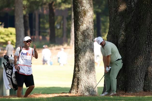 MEMPHIS, TN - AUGUST 08: Chris Gotterup of United States and his caddie discuss shot options before hitting from under a tree on No. 7 during the second round of the FedEx St. Jude Championship, August 8, 2025, at TPC Southward in Memphis, Tennessee. (Photo by Matthew Maxey Icon Sportswire) GOLF: AUG 08 PGA, Golf Herren FedEx Cup Playoffs - FedEx St. Jude Championship EDITORIAL USE ONLY Icon250808012