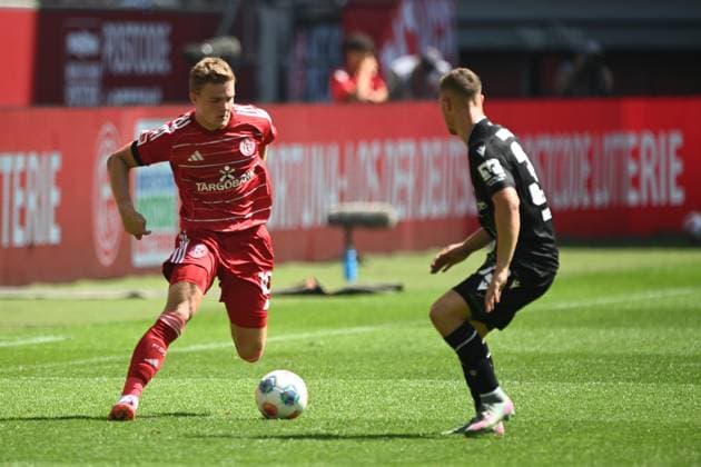 Christian RASMUSSEN D vs Maurice NEUBAUER Hannover 96 action, duel, Soccer 2 Bundesliga, 2 Matchday, Fortuna Duesseldorf D Hannover 96 H 0 2 on 09 08 2025 at Merkur Spiel Arena Duesseldorf Germany DFL regulations prohibit any use of photographs as image sequences and or quasi video ÃÂ