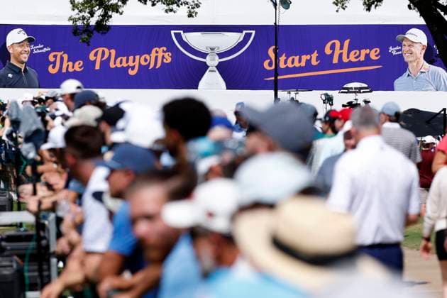MEMPHIS, TN - AUGUST 09: A sign reading ÒThe Playoffs Start HereÓ is on a building above fans looking onto the driving range during the third round of the FedEx St. Jude Championship, August 9, 2025, at TPC Southward in Memphis, Tennessee. (Photo by Matthew Maxey Icon Sportswire) GOLF: AUG 09 PGA, Golf Herren FedEx Cup Playoffs - FedEx St. Jude Championship EDITORIAL USE ONLY Icon250809002