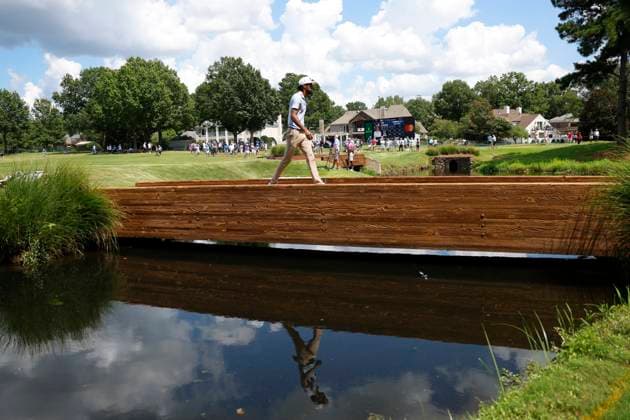 MEMPHIS, TN - AUGUST 09: Akshay Bhatia of the United States walks across the bridge behind No. 11 during the third round of the FedEx St. Jude Championship, August 9, 2025, at TPC Southward in Memphis, Tennessee. (Photo by Matthew Maxey Icon Sportswire) GOLF: AUG 09 PGA, Golf Herren FedEx Cup Playoffs - FedEx St. Jude Championship EDITORIAL USE ONLY Icon250809053