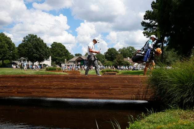 MEMPHIS, TN - AUGUST 09: Collin Morikawa of the United States walks across the bridge behind No. 11 during the third round of the FedEx St. Jude Championship, August 9, 2025, at TPC Southward in Memphis, Tennessee. (Photo by Matthew Maxey Icon Sportswire) GOLF: AUG 09 PGA, Golf Herren FedEx Cup Playoffs - FedEx St. Jude Championship EDITORIAL USE ONLY Icon250809060