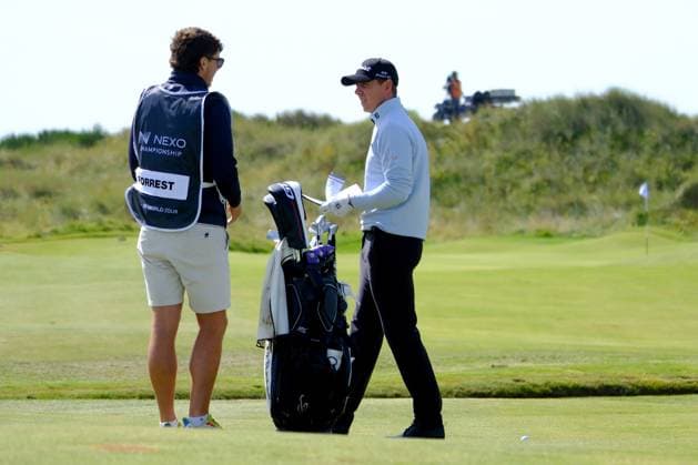 UK: Nexo Championship, Old Course at Trump International Golf Links, Aberdeen, Scotland on 10 August 2025: Pictured: Grant Forrest (Scotland) chats to his caddie on the 2nd fairway during the final round of the Nexo Championship 2025 at Trump International Golf Links, Aberdeenshire, Scotland Aberdeen Trump International Golf Links Scotland Copyright: xAlexxToddx