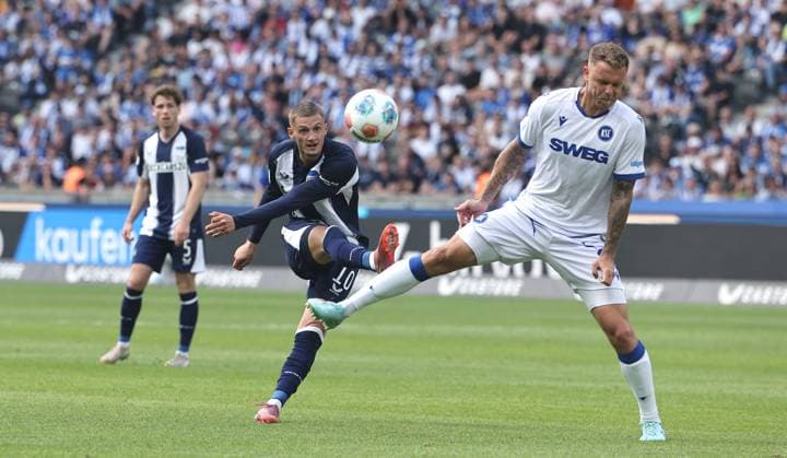 Michael Cuisance shoots, Marcel Franke duel Match scene Action Sport Football Soccer DFL 2 Bundesliga Men 2 Matchday Season 2025 2026 10 08 2025 Hertha BSC Berlin vs Karlsruher SC KSC DFL regulations prohibit any use of photographs as image sequences and or quasi video