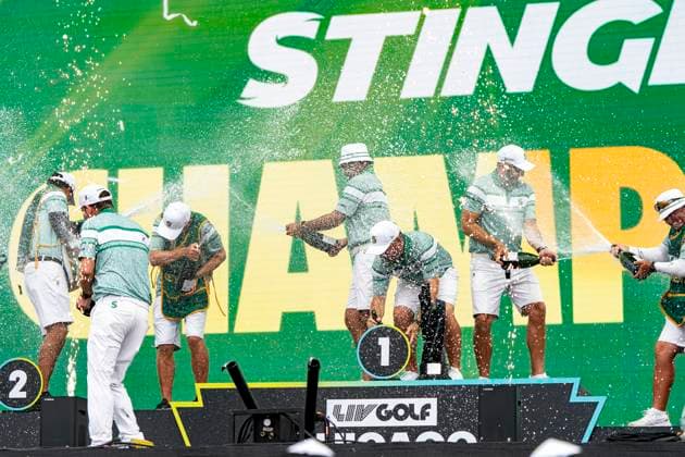 BOLINGBROOK, IL - AUGUST 10: Members of Stinger GC celebrate winning the LIV Golf Chicago team championship by spraying champagne on each other onstage after the final round of LIV Golf Chicago on Sunday, August 10, 2025 at Bolingbrook Golf Club in Bolingbrook, IL (Photo by Ben Hsu Icon Sportswire) GOLF: AUG 10 LIV Golf Chicago EDITORIAL USE ONLY Icon224250810076