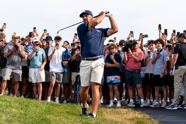 BOLINGBROOK, IL - AUGUST 10: Bryson DeChambeau hits the ball from the rough while surrounded by fans during the final round of LIV Golf Chicago on Sunday, August 10, 2025 at Bolingbrook Golf Club in Bolingbrook, IL (Photo by Ben Hsu Icon Sportswire) GOLF: AUG 10 LIV Golf Chicago EDITORIAL USE ONLY Icon224250810017