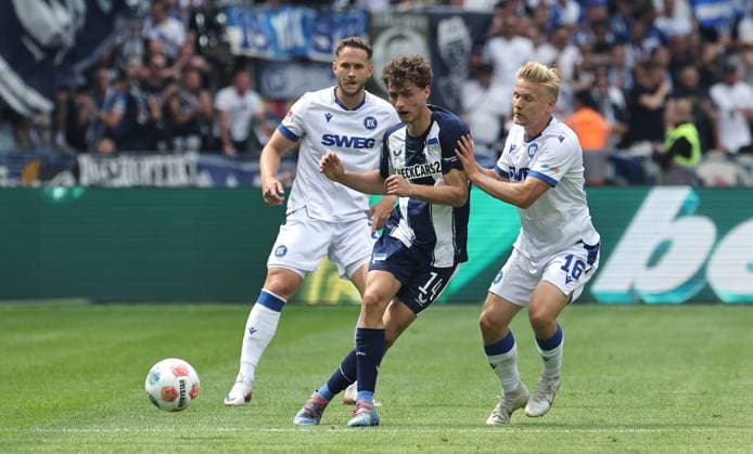 Maurice Krattenmacher on the ball, Andreas Müller duel Match scene Action Sport Football Soccer DFL 2 Bundesliga Men 2 Matchday Season 2025 2026 10 08 2025 Hertha BSC Berlin vs Karlsruher SC KSC DFL regulations prohibit any use of photographs as image sequences and or quasi video