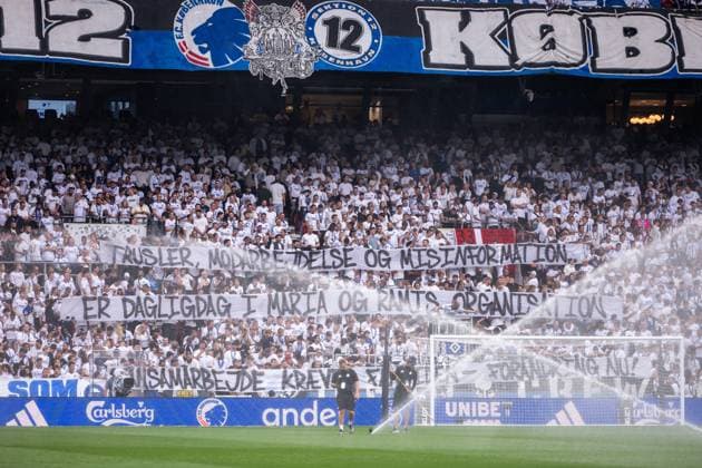 250812 Fans of FC Copenhagen with a banner ahead of the UEFA Champions League qualifier football match between FC Copenhagen and Malmö FF on August 12, 2025 in Copenhagen Photo Petter Arvidson BILDBYRAN kod PA PA1061 fotboll football soccer fotball uefa champions league champions league fc copenhagen malmö ff bbeng kval fc köpenhamn publik  Copyright: PETTERxARVIDSON BB250812PA032