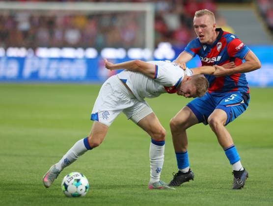 Oliver Antman of Rangers holds off Karel Spacil of FC Viktoria Plzen during the UEFA Champions League Third Round qualifying second leg at the Doosan Arena, Plzen. Viktoria Plzen v Rangers, UEFA Champions League, 3rd Qualifying Round, Second Leg, Football, Doosan Arena, Plzen, Czech Republic, UK - 12 Aug 2025Plzen Doosan Arena Czech Republic EDITORIAL USE ONLY No use with unauthorised audio, video, data, fixture lists, club league logos or live services. Online in-match use limited to 120 images, no video emulation. No use in betting, games or single club league player publications. Copyright: xRangersxFC Shutterstockx 15438242eb