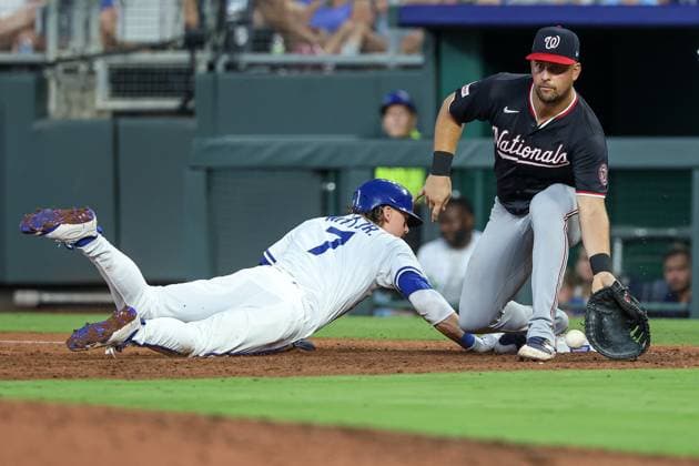 August 12, 2025: Kansas City Royals shortstop Bobby Witt Jr. (7) slides back into first base safe against Washington Nationals first baseman Nathaniel Lowe (33) during the sixth inning at Kauffman Stadium in Kansas City, MO. CSM Kansas City United States of America - ZUMAc04_ 20250812_zma_c04_083 Copyright: xDavidxSmithx