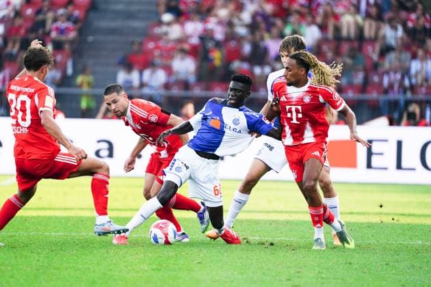 12 08 25 Stadium Letzigrund,Soccer Men Test Match Season 2025 2026 GC Zuerich FC Bayern Muenchen 1 2 Picture Sasha Boey FC Bayern Muenchen Bara Sapoko Ndiaye GC Mitte Action duel