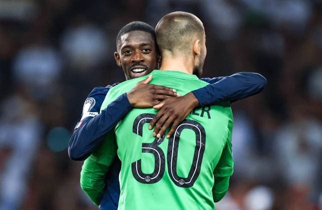 Italy Soccer Super Cup PSG - Tottenham 8980729 14.08.2025 Paris Saint-Germain s Ousmane Dembele and goalkeeper Lucas Chevalier react during a penalty series in the UEFA Super Cup final soccer match between Paris Saint-Germain (PSG) and Tottenham Hotspur at the Bluenergy Stadium in Udine, Italy. Nafis Sirazetdinov Sputnik Udine Italy  Copyright: xNafisxSirazetdinovx