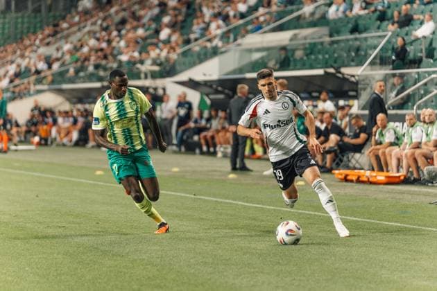 Legia Warszawa v AEK Larnaka - UEFA Europa League Godswill Ekpolo of AEK Larnaka and Ruben Vinagre of Legia Warszawa are seen in action during the 3rd qualifying round match between Legia Warszawa and AEK Larnaka at Marshal Jozef Pilsudski Legia Warsaw Municipal Stadium in Warsaw, Poland, on August 14, 2025. Warsaw Poland  Copyright: xMarekxAntonixIwaÅ czukx originalFilename:iwanczuk-uefaeuro250814_npEHz.jpg