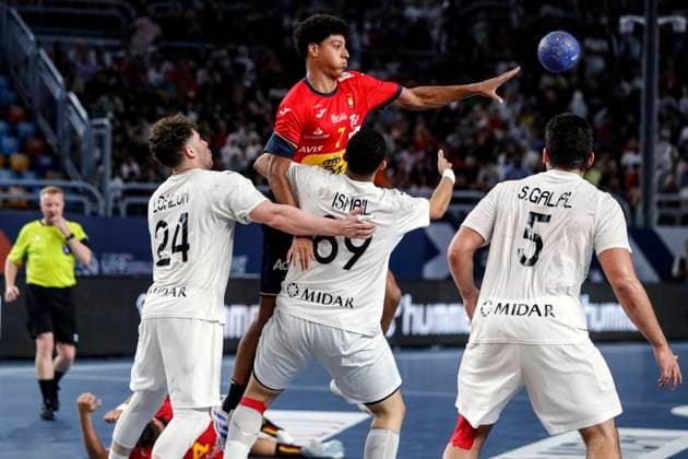 (250815) -- CAIRO, Aug. 15, 2025 -- Marcos Fis Ballester (top) of Spain shoots during the quarterfinal handball match between Spain and Egypt at the 11th IHF Men s Youth World Championship, WM, Weltmeisterschaft 2025 in Cairo, Egypt, on Aug. 14, 2025. ) (SP)EGYPT-CAIRO-HANDBALL-MEN S YOUTH WORLD CHAMPIONSHIP-QUARTERFINAL-SPAIN VS EGYPT AhmedxGomaa 