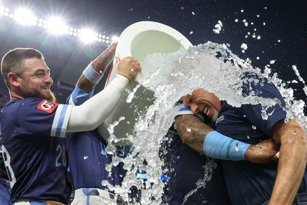 August 15, 2025: Kansas City Royals catcher Salvador Perez (13) hugs broadcaster Joel Goldberg as they are doused by center fielder Kyle Isbel (28) and third baseman Maikel Garcia (11) after their win over the Chicago White Sox at Kauffman Stadium in Kansas City, MO. CSM Kansas City United States of America - ZUMAc04_ 20250815_zma_c04_233 Copyright: xDavidxSmithx