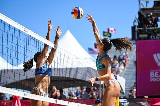 MONTREAL, QC - AUGUST 15: Lexy Denaburg (USA) attempts to block Jana Milutinovic (AUS) smash during a first round match at Beach Pro Tour Montreal Elite 16 on August 15, 2025 at Parc Jean-Drapeau in Montreal, QC (Photo by David Kirouac Icon Sportswire) VOLLEYBALL: AUG 15 Beach Pro Tour Montreal Elite 16 EDITORIAL USE ONLY Icon250815071