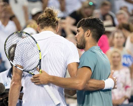 CINCINNATI, OH - AUGUST 16: Carlos Alcaraz (ESP) hugs Alexander Zverev (GER) in friendship and good sportsmanship after winning the semifinals in the Cincinnati Open at the Lindner Family Tennis Center on August 16, 2025 in Mason, OH. (Photo by Shelley Lipton Icon Sportswire) TENNIS: AUG 16 Cincinnati Open EDITORIAL USE ONLY Icon250816685