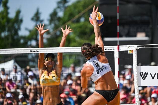 MONTREAL, QC - AUGUST 16: Lexy Denaburg (USA) smashes the ball against Thamela Coradello Galil (BRA) during a round of 12 match at Beach Pro Tour Montreal Elite 16 on August 16, 2025 at Parc Jean-Drapeau in Montreal, QC (Photo by David Kirouac Icon Sportswire) VOLLEYBALL: AUG 16 Beach Pro Tour Montreal Elite 16 EDITORIAL USE ONLY Icon250816170