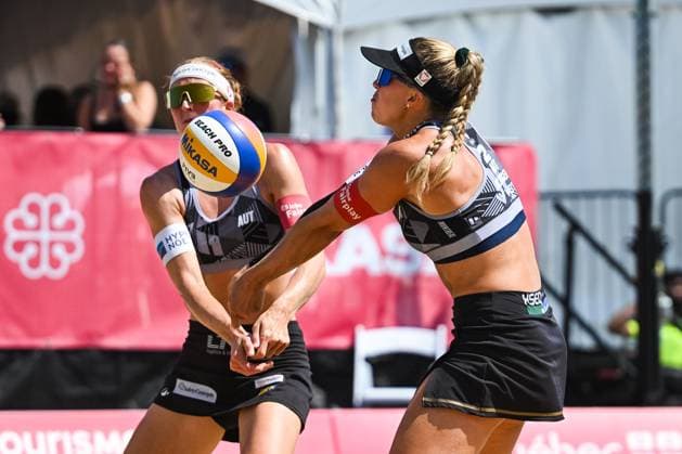 MONTREAL, QC - AUGUST 16: Ronja Klinger (AUT) bump the ball as the same time Dorina Klinger (AUT) was ready to do so during a round of 12 match at Beach Pro Tour Montreal Elite 16 on August 16, 2025 at Parc Jean-Drapeau in Montreal, QC (Photo by David Kirouac Icon Sportswire) VOLLEYBALL: AUG 16 Beach Pro Tour Montreal Elite 16 EDITORIAL USE ONLY Icon250816113