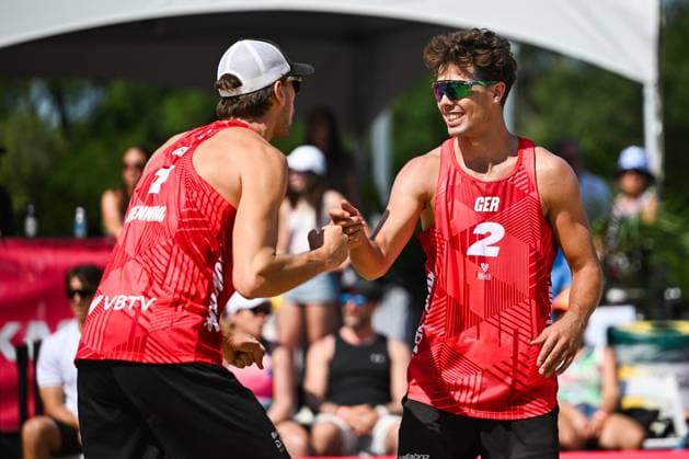 MONTREAL, QC - AUGUST 16: Lui Wust (GER) and Paul Henning (GER) react after scoring a point during a round of 12 match at Beach Pro Tour Montreal Elite 16 on August 16, 2025 at Parc Jean-Drapeau in Montreal, QC (Photo by David Kirouac Icon Sportswire) VOLLEYBALL: AUG 16 Beach Pro Tour Montreal Elite 16 EDITORIAL USE ONLY Icon250816030