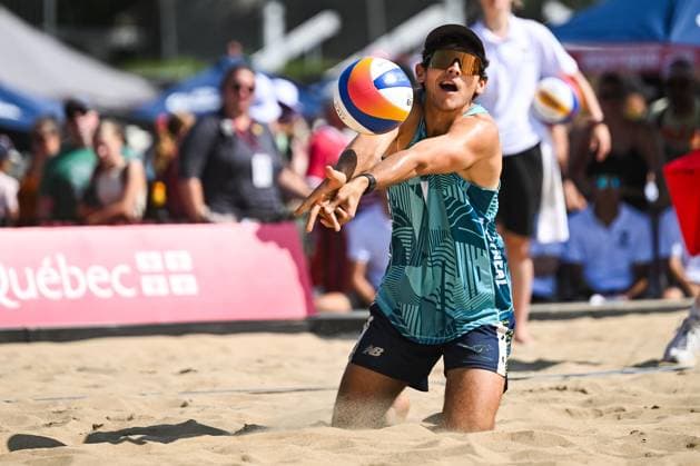 MONTREAL, QC - AUGUST 16: Izac Carracher (AUS) bumps the ball during a round of 12 match at Beach Pro Tour Montreal Elite 16 on August 16, 2025 at Parc Jean-Drapeau in Montreal, QC (Photo by David Kirouac Icon Sportswire) VOLLEYBALL: AUG 16 Beach Pro Tour Montreal Elite 16 EDITORIAL USE ONLY Icon250816011