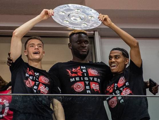 Bayer Leverkusen win first-ever German Bundesliga title LEVERKUSEN, GERMANY - APRIL 14: Florian Wirtz, Victor Boniface and Amine Adli of Bayer 04 Leverkusen celebrate their first Bundesliga title in the stadium after the Bundesliga match between Bayer 04 Leverkusen and Werder Bremen at BayArena on April 14, 2024 in Leverkusen, Germany. Germany World. Editorial use only. Please get in touch for any other usage.  Copyright: x2025xAnadoluxHeshamxElsherifx
