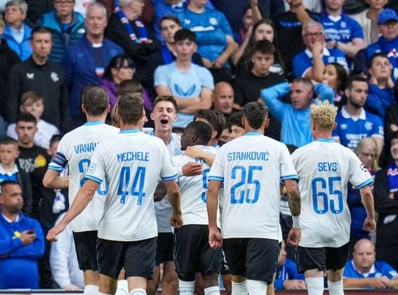 Jorne Spileers of Club Brugge celebrates with team mates after scoring to give Brugge a 0-2 lead. Rangers v Club Brugge, UEFA Champions League, Play-Off Round, First Leg, Football, Ibrox Stadium, Glasgow, Scotland, UK - 19 Aug 2025Glasgow Ibrox Stadium Scotland United Kingdom EDITORIAL USE ONLY No use with unauthorised audio, video, data, fixture lists, club league logos or live services. Online in-match use limited to 120 images, no video emulation. No use in betting, games or single club league player publications.  Copyright: xStuartxWallace Shutterstockx 15446679t