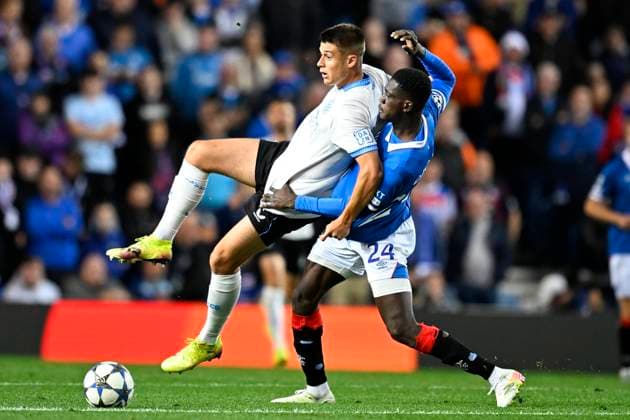 Rangers FC v Club Brugge - UEFA Champions League GLASGOW, SCOTLAND - AUGUST 19 : Tresoldi Nicolo forward of Club Brugge and Djiga Nasser defender of Rangers FC during the UEFA Champions League 2025 26 play-off round first leg between Rangers FC and Club Brugge on August 19, 2025 in Glasgow, Scotland, 19 08 2025 Glasgow Scotland  Copyright: xTomasxSiskx