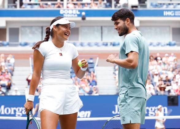Emma Raducanu of Great Britain and Carlos Alcaraz of Spain celebrate after a point in their round one match against Jessica Pegula and Jack Draper of Great Britain in the mixed doubles championships in Arthur Ashe Stadium at the 2025 US Open Tennis Championship at the USTA Billie Jean King National Tennis Center in New York City on Tuesday, August 19, 2025 in New York City. Jessica Pegula and Jack Draper of Great Britain defeated Emma Raducanu of Great Britain and Carlos Alcaraz of Spain 4-2, 4-2 and advance to the quarterfinals.  NYP20250819104 JOHNxANGELILLO