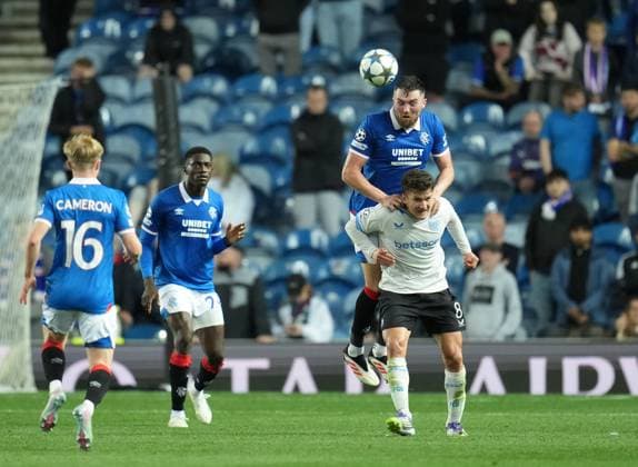 John Souttar of Rangers heads the ball above Christos Tzolis of Club Brugge Rangers v Club Brugge, UEFA Champions League, Play-Off Round, First Leg, Football, Ibrox Stadium, Glasgow, Scotland, UK - 19 Aug 2025Glasgow Ibrox Stadium Scotland United Kingdom EDITORIAL USE ONLY No use with unauthorised audio, video, data, fixture lists, club league logos or live services. Online in-match use limited to 120 images, no video emulation. No use in betting, games or single club league player publications. Copyright: xStuartxWallace Shutterstockx 15446679dm