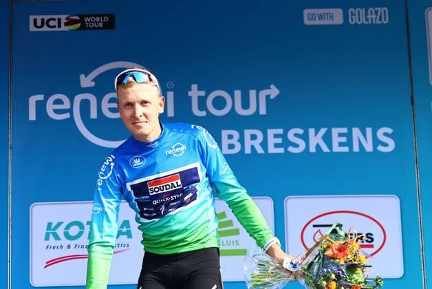 Belgian Tim Merlier of Soudal Quick-Step celebrates on the podium in the leader s jersey after winning the first stage of the Renewi Tour multi-stage cycling race, from Terneuzen to Breskens, The Netherlands (182,7 km) on Wednesday 20 August 2025. The five-day race takes place in Belgium and the Netherlands. DAVIDxPINTENS  x131652719x