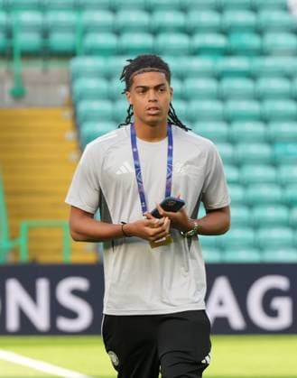 Jahmai Simpson-Pusey of Celtic on the pitch shortly after arriving at Celtic Park. Celtic v Kairat Almaty, UEFA Champions League, Play-Off Round, First Leg, Football, Celtic Park, Glasgow, Scotland, UK - 20 Aug 2025Glasgow Celtic Park Scotland United Kingdom EDITORIAL USE ONLY No use with unauthorised audio, video, data, fixture lists, club league logos or live services. Online in-match use limited to 120 images, no video emulation. No use in betting, games or single club league player publications. Copyright: xStuartxWallace Shutterstockx 15446684a
