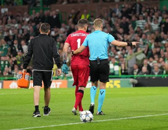 Injured Kairat Almaty goalkeeper Alexandr Zarutskiy limps off the pitch after rejecting a stretcher. Celtic v Kairat Almaty, UEFA Champions League, Play-Off Round, First Leg, Football, Celtic Park, Glasgow, Scotland, UK - 20 Aug 2025Glasgow Celtic Park Scotland United Kingdom EDITORIAL USE ONLY No use with unauthorised audio, video, data, fixture lists, club league logos or live services. Online in-match use limited to 120 images, no video emulation. No use in betting, games or single club league player publications.  Copyright: xStuartxWallace Shutterstockx 15446684ay
