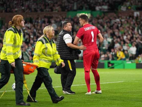 Injured Kairat Almaty goalkeeper Alexandr Zarutskiy limps off the pitch after rejecting a stretcher. Celtic v Kairat Almaty, UEFA Champions League, Play-Off Round, First Leg, Football, Celtic Park, Glasgow, Scotland, UK - 20 Aug 2025Glasgow Celtic Park Scotland United Kingdom EDITORIAL USE ONLY No use with unauthorised audio, video, data, fixture lists, club league logos or live services. Online in-match use limited to 120 images, no video emulation. No use in betting, games or single club league player publications.  Copyright: xStuartxWallace Shutterstockx 15446684az
