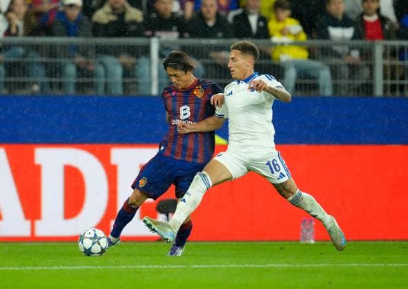 August 20, 2025, Basel, Switzerland: FC Basel 1893 defender KEIGO TSUNEMOTO (6) moves the ball against FC Copenhagen midfielder ROBERT (16) during the UEFA Champions League Playoff match between FC Basel 1893 and FC Copenhagen on August 20, 2025, in Basel, Switzerland. The match finished a 1-1 draw. Basel Switzerland - ZUMAc201 20250820_zap_c201_008 Copyright: xScottxColemanx