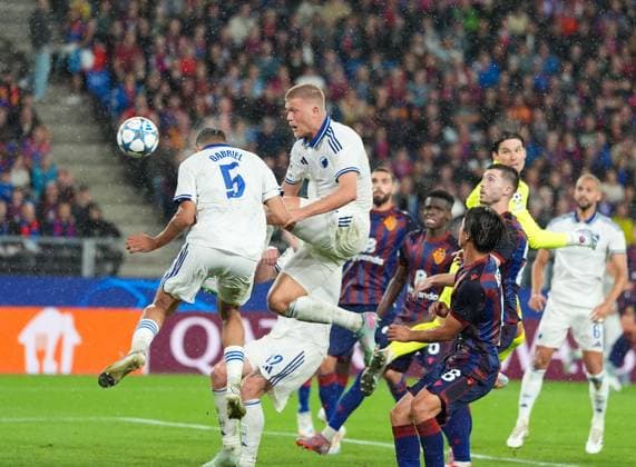 August 20, 2025, Basel, Switzerland: FC Copenhagen defender GABRIEL PEREIRA (5) and FC Copenhagen forward ANDREAS CORNELIUS (14) get a ball past FC Basel 1893 goalkeeper MARWIN HITZ (1) for a goal during the UEFA Champions League Playoff match between FC Basel 1893 and FC Copenhagen on August 20, 2025, in Basel, Switzerland. The match finished a 1-1 draw. Basel Switzerland - ZUMAc201 20250820_zap_c201_010 Copyright: xScottxColemanx