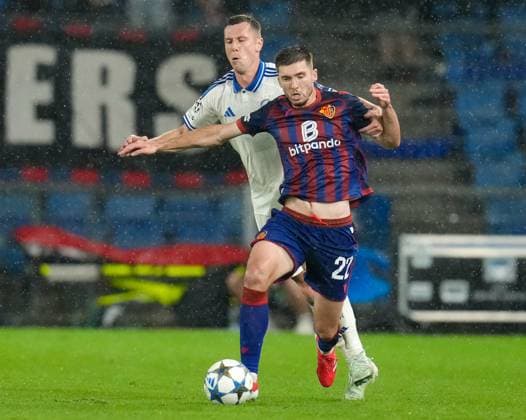 August 20, 2025, Basel, Switzerland: FC Basel 1893 midfielder LEO LEROY (22) works against FC Copenhagen midfielder LUKAS LERAGER (12) during the UEFA Champions League Playoff match between FC Basel 1893 and FC Copenhagen on August 20, 2025, in Basel, Switzerland. The match finished a 1-1 draw. Basel Switzerland - ZUMAc201 20250820_zap_c201_012 Copyright: xScottxColemanx