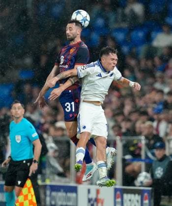 August 20, 2025, Basel, Switzerland: FC Basel 1893 defender DOMINIK SCHMID (31) leaps to head the ball against FC Copenhagen midfielder RODRIGO HUESCAS (13) during the UEFA Champions League Playoff match between FC Basel 1893 and FC Copenhagen on August 20, 2025, in Basel, Switzerland. The match finished a 1-1 draw. Basel Switzerland - ZUMAc201 20250820_zap_c201_027 Copyright: xScottxColemanx