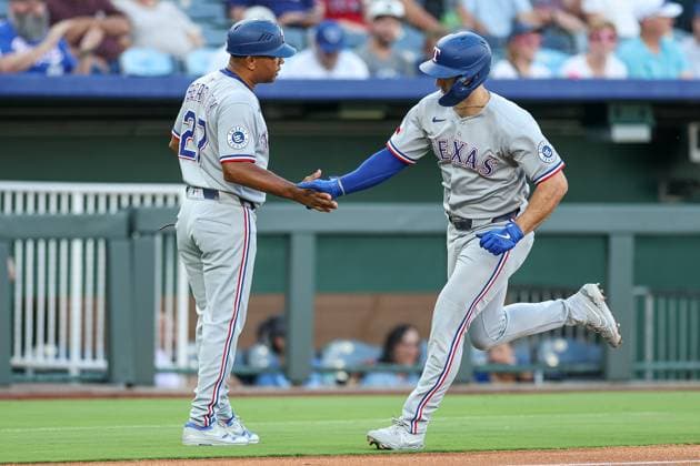 August 20, 2025: Texas Rangers left fielder Wyatt Langford (36) and third base coach Tony Beasley (27) celebrate Langford s solo home run during the first inning of a baseball game against the Kansas City Royals at Kauffman Stadium in Kansas City, MO. CSM Kansas City United States of America - ZUMAc04_ 20250820_zma_c04_011 Copyright: xDavidxSmithx