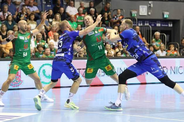 20 082025, xtgx, Handball, Hummel Cup, SC Magdeburg TVB Stuttgart v l Patrick Zieker Stuttgart, 25 , Omar Ingi Magnusson Magdeburg, 14 , Lenny Rubin Stuttgart, 44 duel, duel, fight, tackle Magdeburg