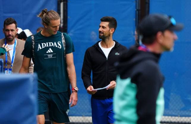 Alexander Zverev is shown a piece of paper by Novak Djokovic 2025 US Open, Thursday Previews, USTA Billie Jean King National Tennis Center, New York, USA - 21 Aug 2025New York Flushing Meadows  Copyright: xJavierxGarcia Shutterstockx 15450990h
