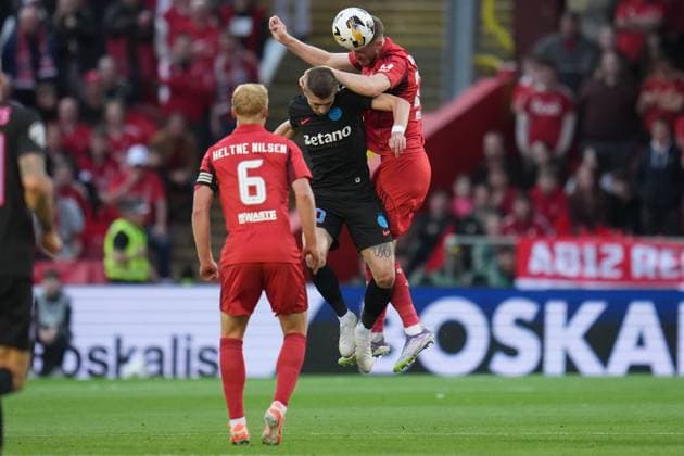 Alfie Dorrington of Aberdeen challenges Florin Tanase of FCSB for the ball Aberdeen v FCSB, UEFA Europa League, Play-Off Round, First Leg, Football, Pittodrie, Aberdeen, Scotland, UK - 21 Aug 2025Aberdeen Pittodrie Scotland United Kingdom EDITORIAL USE ONLY No use with unauthorised audio, video, data, fixture lists, club league logos or live services. Online in-match use limited to 120 images, no video emulation. No use in betting, games or single club league player publications. Copyright: xPetexSummers Shutterstockx 15449391df