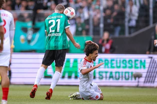 22 08 2025, Football, Preußen Münster 1 FC Nürnberg, 2 Fußball Bundesliga, Preußenstadion, Saison 2025 2026 Rico Preißinger Preussen Muenster 21 in duel against Ayoub Chaikhoun 1FC Nuernberg 17 DFB regulations prohibit any use of photographs as image sequences and or quasi video Nordrhein Westfalen Germany