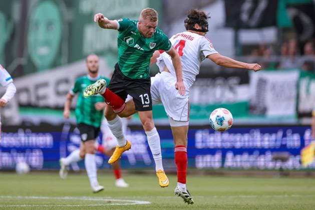 22 08 2025, Football, Preußen Münster 1 FC Nürnberg, 2 Fußball Bundesliga, Preußenstadion, Saison 2025 2026 Lars Lokotsch Preussen Muenster 13 in duel against Fabio Gruber 1FC Nuernberg 04 DFB regulations prohibit any use of photographs as image sequences and or quasi video Nordrhein Westfalen Germany