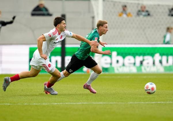 Luka Lochoshvili 1 FC Nuernberg, 24 vs Joshua Mees SC Preussen Muenster, 8 GER, SC Preussen Muenster vs 1 FC Nuernberg 2 Bundesliga, Matchday 3, Season 2025 2026, 22 08 2025 DFL REGULATIONS PROHIBIT ANY USE OF PHOTOGRAPHS AS IMAGE SEQUENCES AND OR QUASI VIDEO GER, SC Preussen Muenster vs 1 FC Nuernberg, 2 Bundesliga, Matchday 3, Season 2025 2026, 22 08 2025 Braunschweig Copyright: xEibner-Pressefoto ScottxColemanx EP_SCN